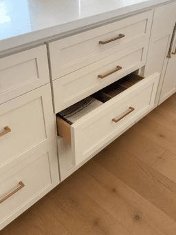 Homeowner photo of a cabinet drawer that will not stay closed